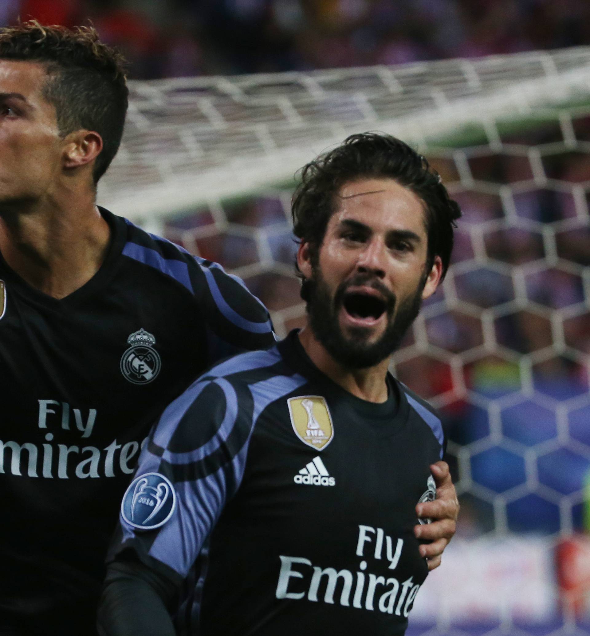 Real Madrid's Isco celebrates scoring their first goal with Cristiano Ronaldo