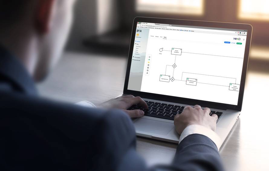 Businessman working on the laptop with blank screen