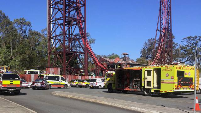 Emergency services vehicles can be seen outside the Dreamworld theme park at Coomera on the Gold Coast after a number of people were reported killed on a ride at Australia's biggest theme park