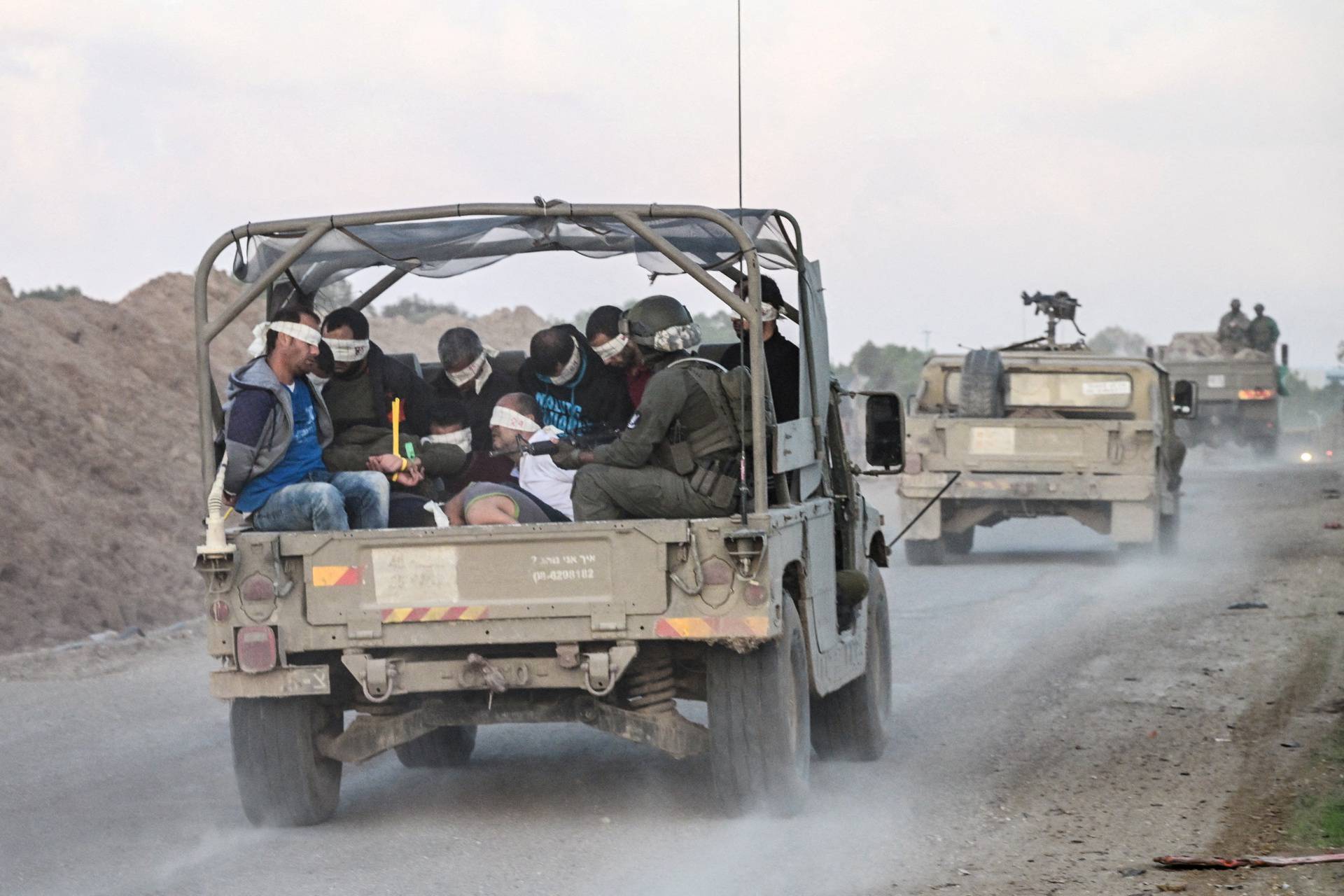 Israel's military transports Palestinian detainees from the Gaza Strip, amid the ongoing conflict between Israel and the Palestinian Islamist group Hamas, near Israel's border with Gaza