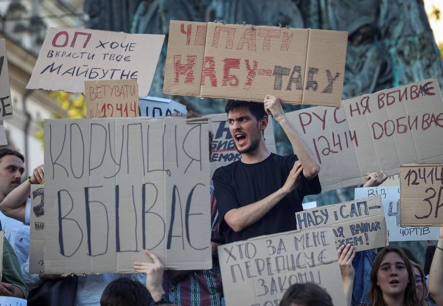 Ukrainians protest against a newly passed law, which curbs independence of anti-corruption institutions in central Lviv
