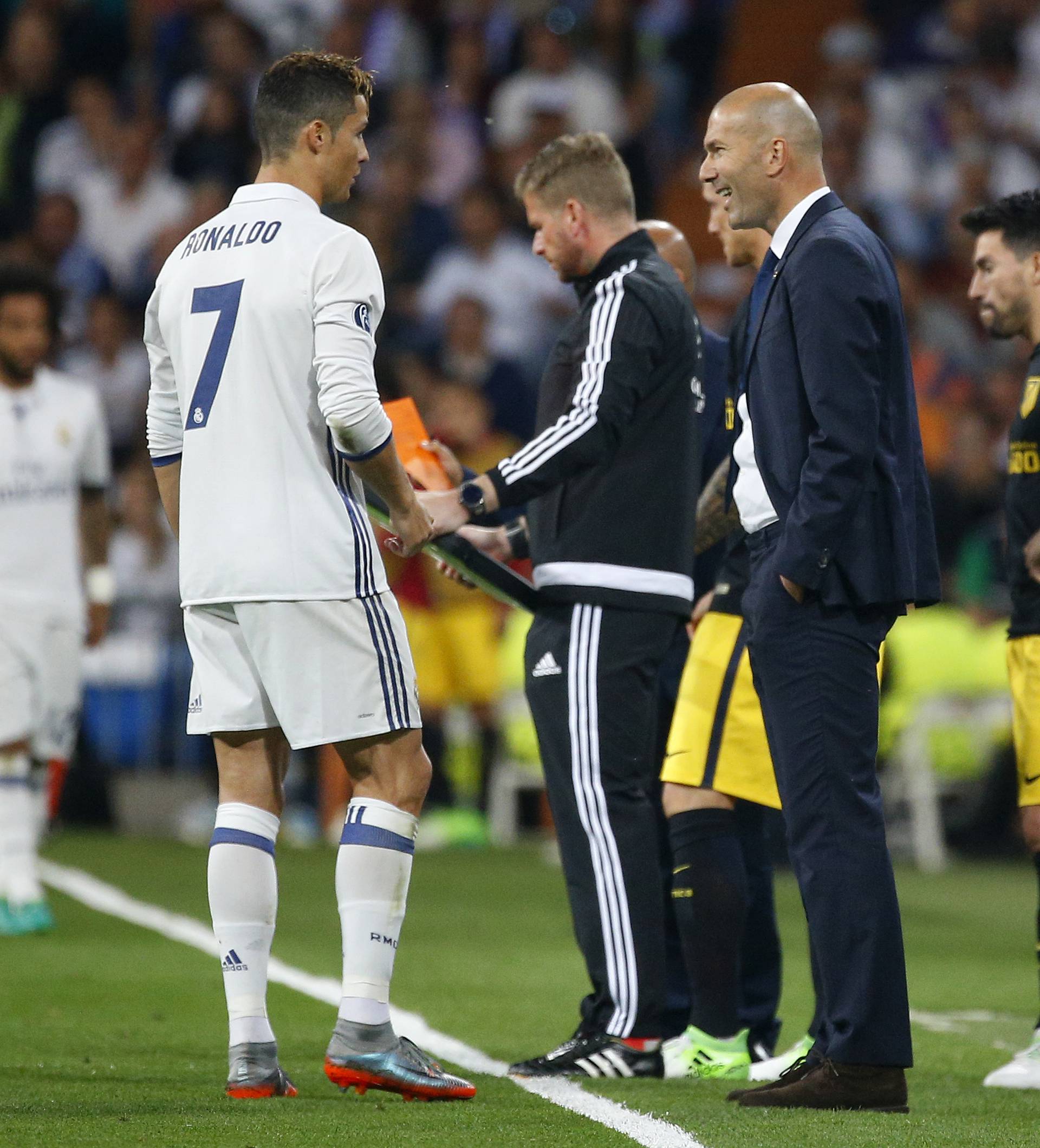 Real Madrid's Cristiano Ronaldo and Real Madrid coach Zinedine Zidane
