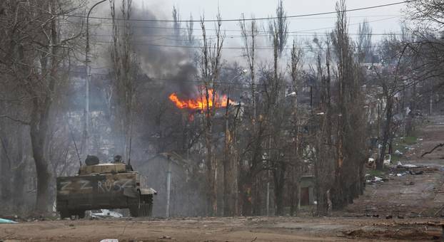 An armoured vehicle of pro-Russian troops is seen in the street in Mariupol