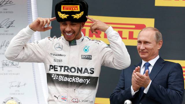 FILE PHOTO: Russian President Putin watches Mercedes' Hamilton celebrates after winning Russian F1 Grand Prix in Sochi