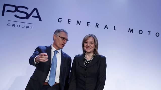 Carlos Tavares, Chairman of the Managing Board of French carmaker PSA Group, and Mary Barra, chairwoman and CEO of General Motors, attend a news conference in Paris