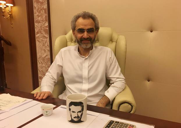 FILE PHOTO: Saudi Arabian billionaire Prince Alwaleed bin Talal sits for an interview with Reuters in the office of the suite where he has been detained at the Ritz-Carlton in Riyadh