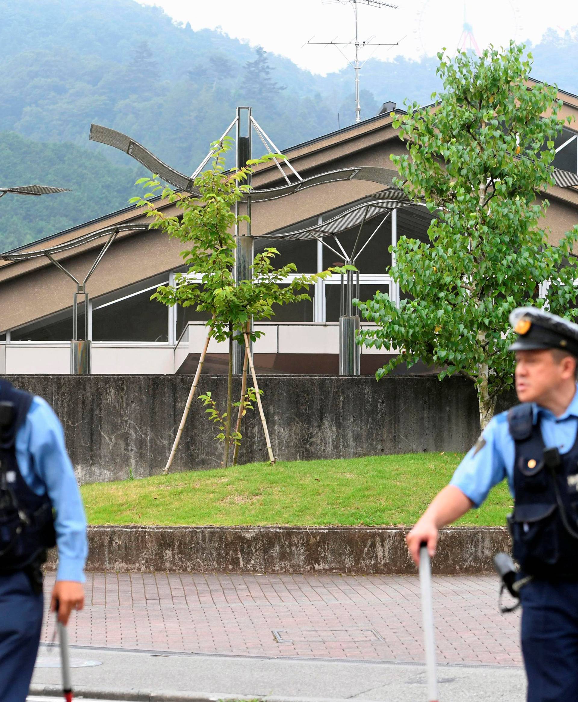 Police officers are seen in front of a facility for the disabled where at least 19 people were killed and as many as 20 wounded by a knife-wielding man, in Sagamihara, Kanagawa prefecture, Japan