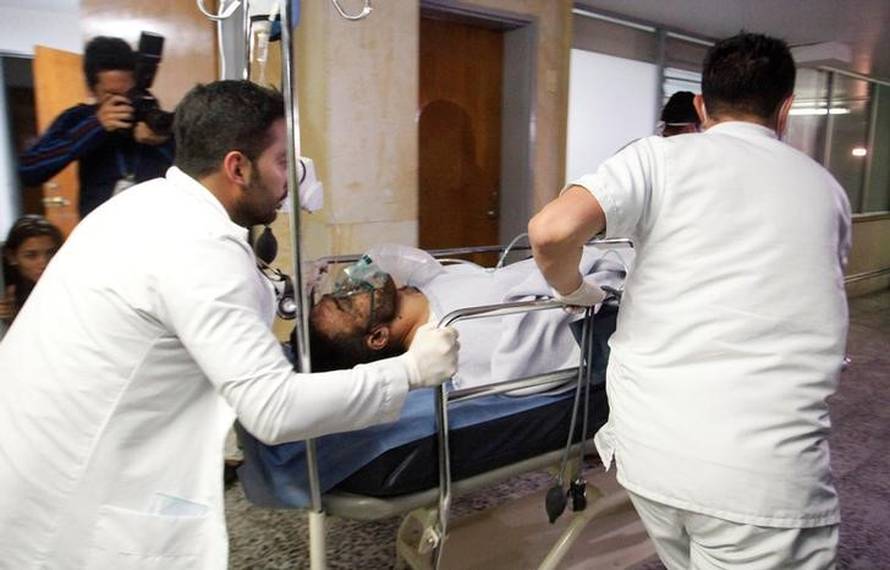 Brazilian soccer player Alan Luciano Ruschel of Chapecoense soccer club receives medical attention after a plane crash in Antioquia, central Colombia