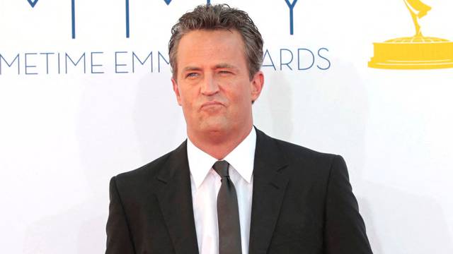 FILE PHOTO: Actor Matthew Perry arrives at the 64th Primetime Emmy Awards in Los Angeles