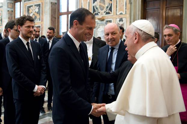 Juventus coach Allegri shakes hands with Pope Francis during a private audience at the Vatican