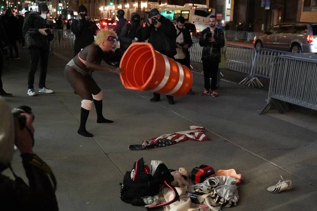 A woman with a U.S. President Donald Trump mask demonstrates outside Trump Tower on Election Day in the Manhattan borough of New York City