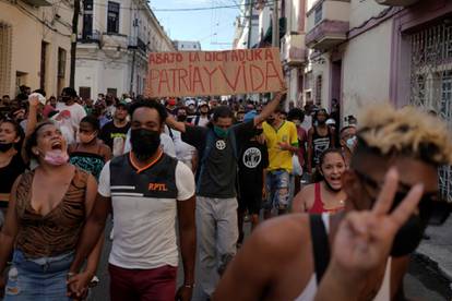 People shout slogans against the government during a protest in Havana