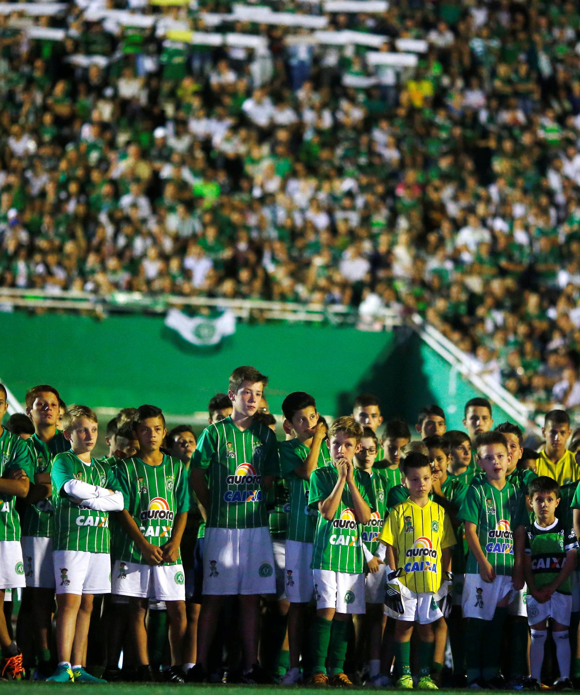 Youth players of Chapecoense soccer club pay tribute to Chapecoense's players at the Arena Conda stadium in Chapeco