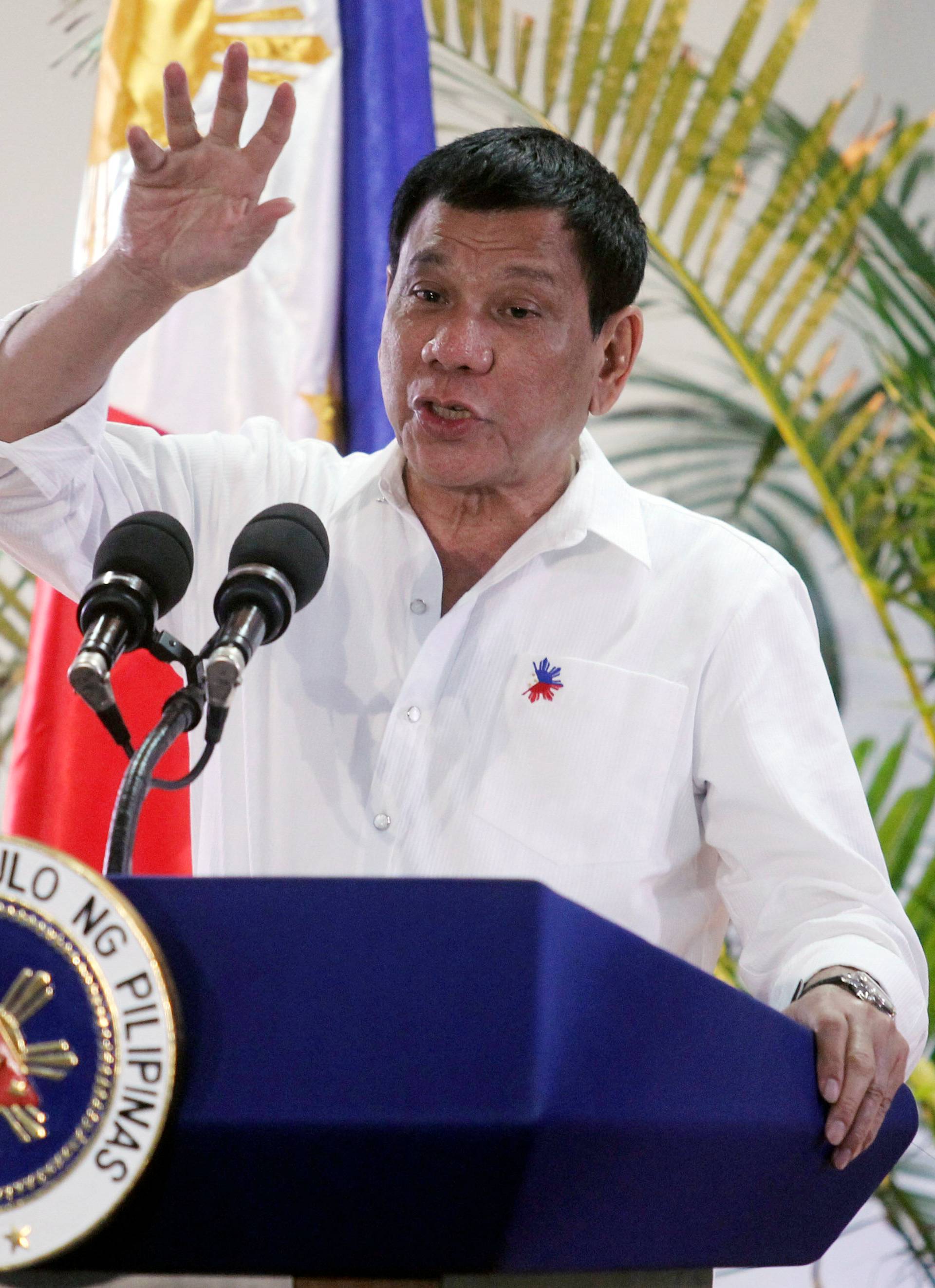 Philippine President Rodrigo Duterte gestures while answering questions during a news conference in Davao city 