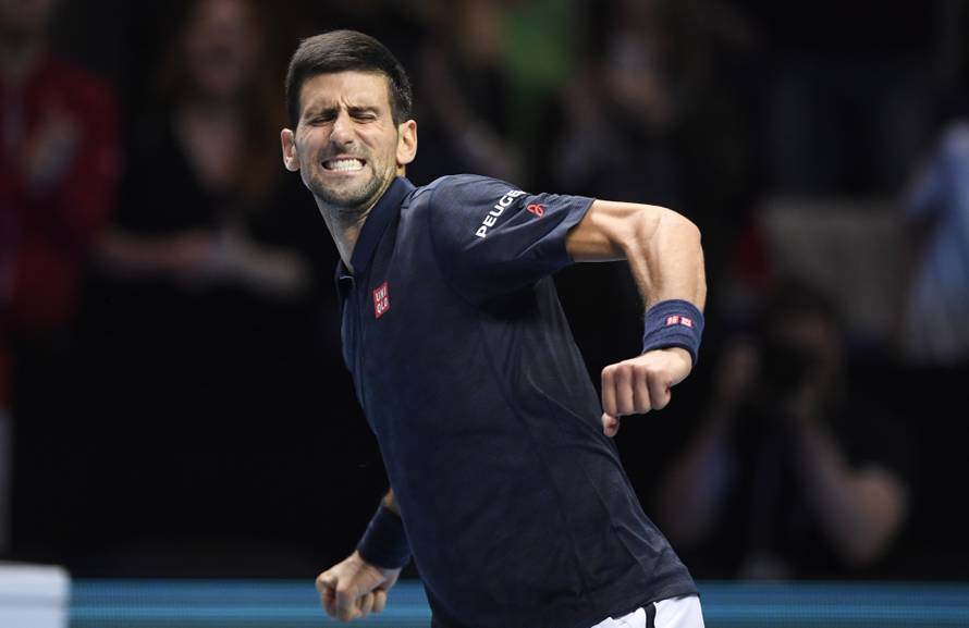 Serbia's Novak Djokovic celebrates winning his round robin match with Austria's Dominic Thiem