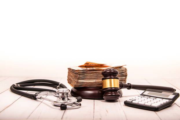 Compensation,And,Judge's,Gavel.,Award,Of,Moral,Financial,Compensation,For