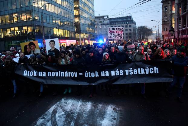 Participants march in honour of murdered Slovak investigative reporter Jan Kuciak