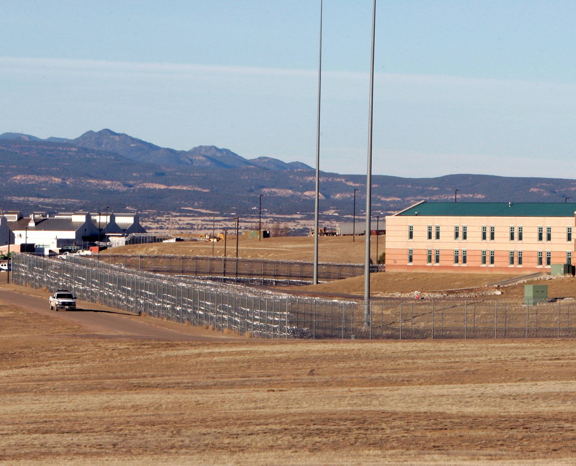 FILE PHOTO: Patrol vehicle is seen along the fencing at the Federal Correctional Complex, including the Administrative Maximum Penitentiary or "Supermax" prison, in Florence, Colorado