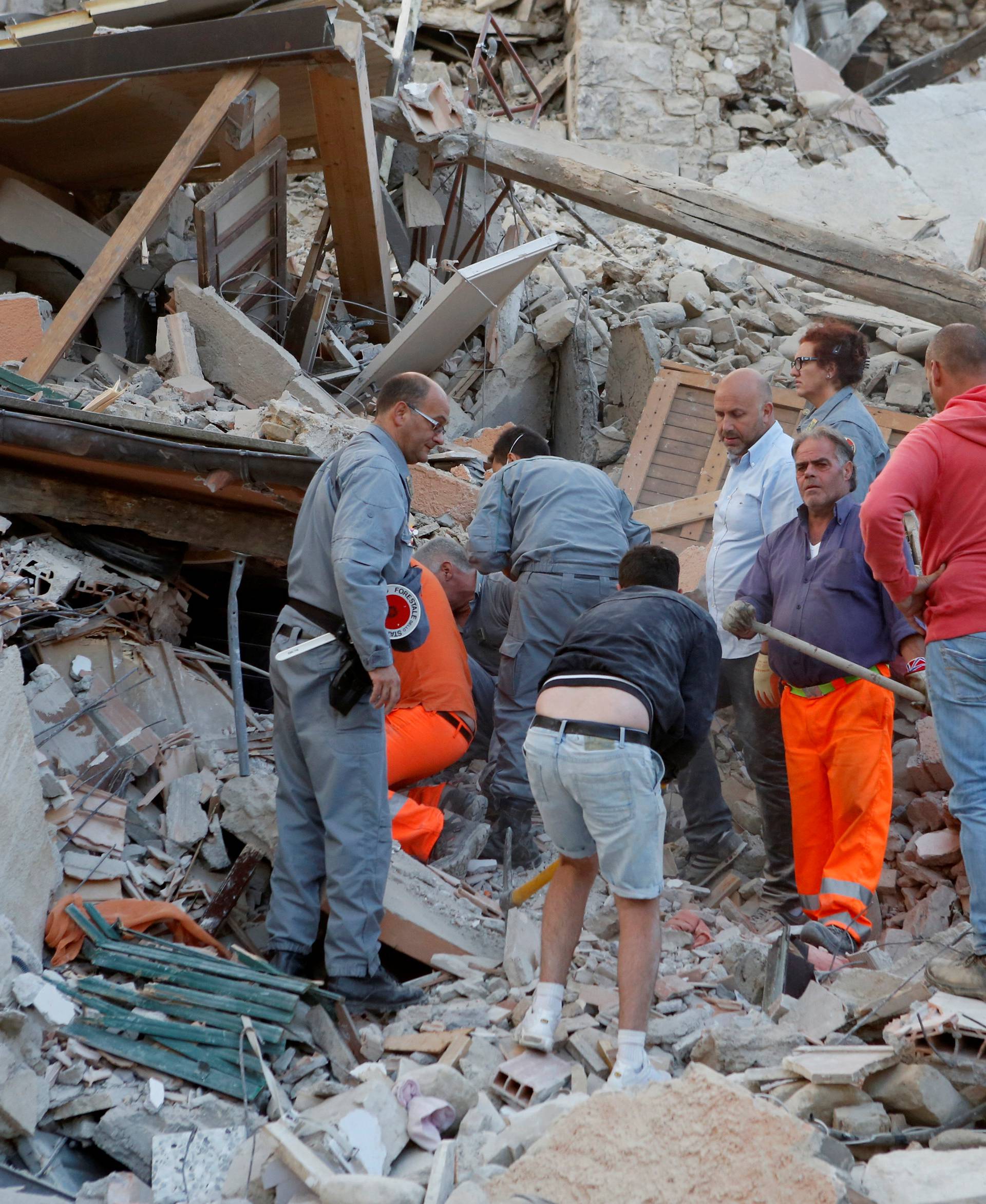 Rescuers works after a quake hit Amatrice 