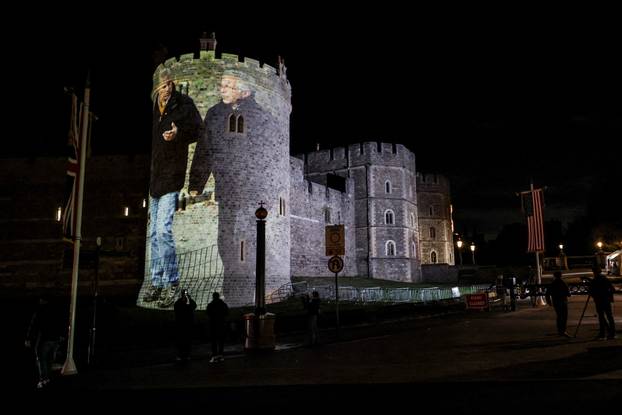 Image of Britain's Prince Andrew alongside disgraced financier Jeffrey Epstein is projected on Windsor castle