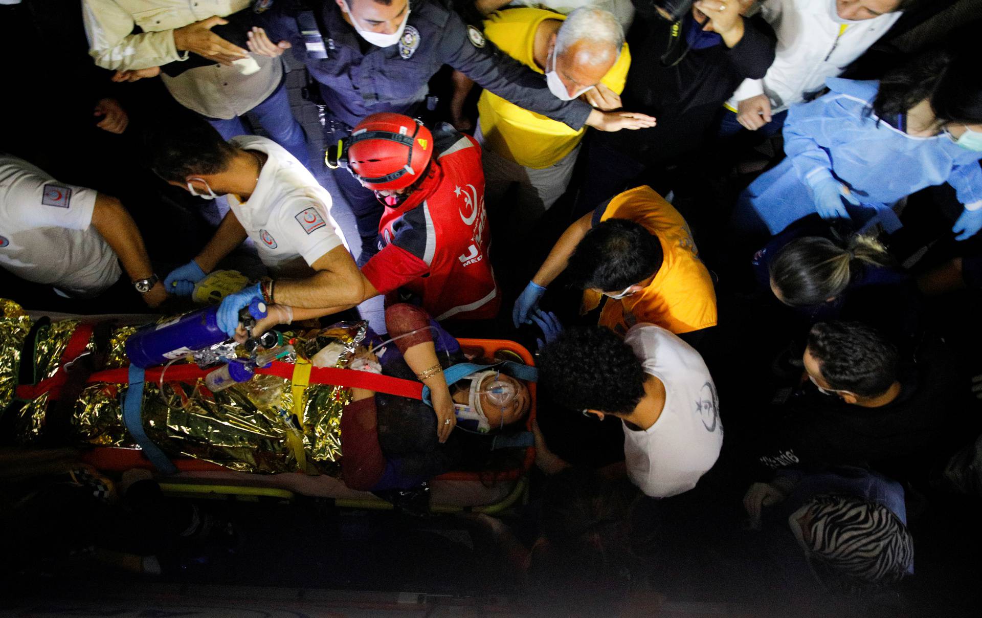 Rescue operations take place on a site after an earthquake struck the Aegean Sea, in the coastal province of Izmir