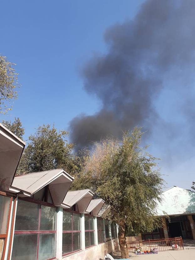 Smoke billows near military hospital after an explosion in Kabul