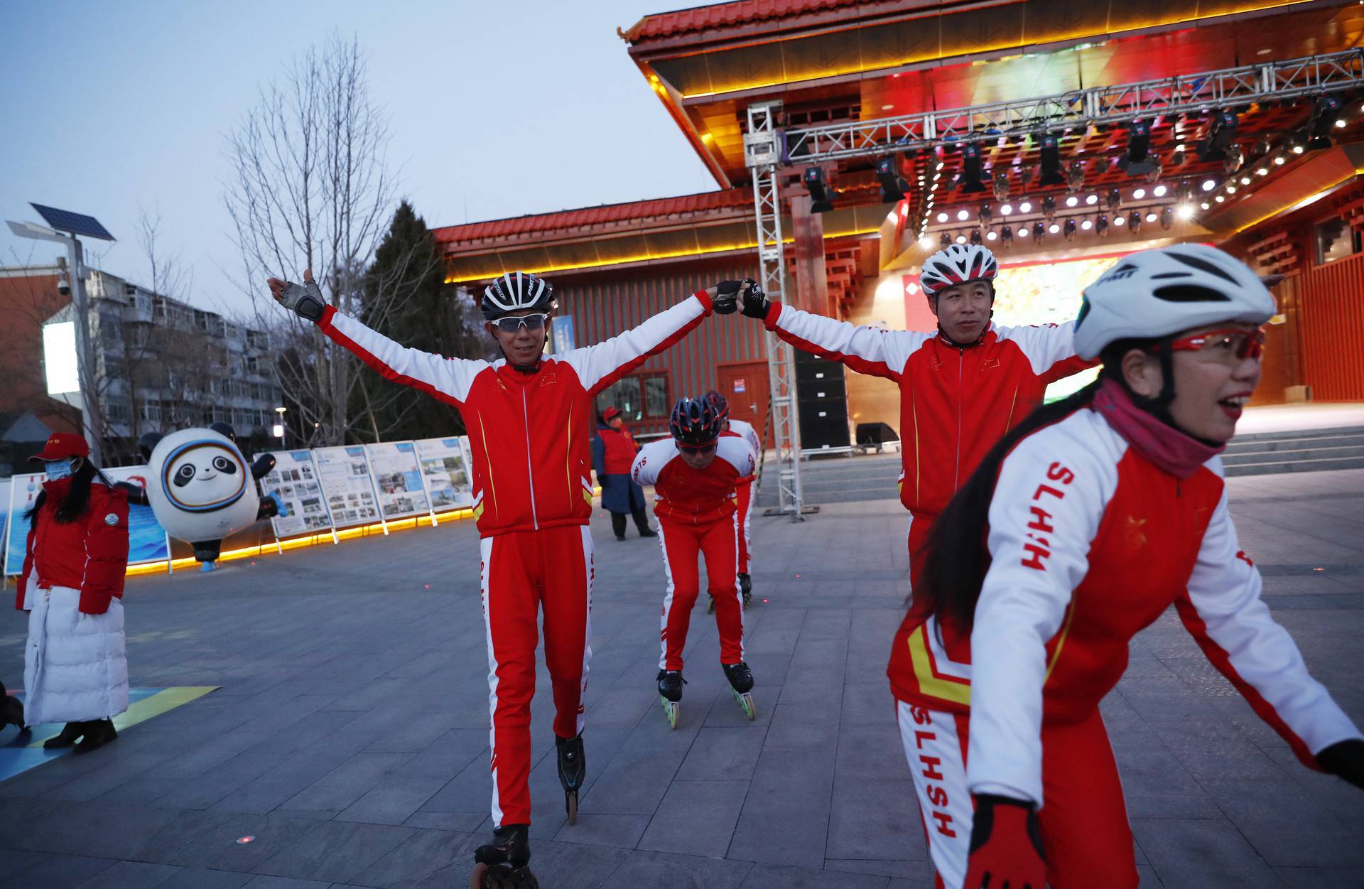 Amateur skaters take part in a filming during a community event in Beijing