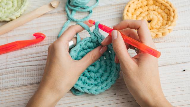 woman hands knitting crochet. hobby crafts things. Top view. Horizontal composition