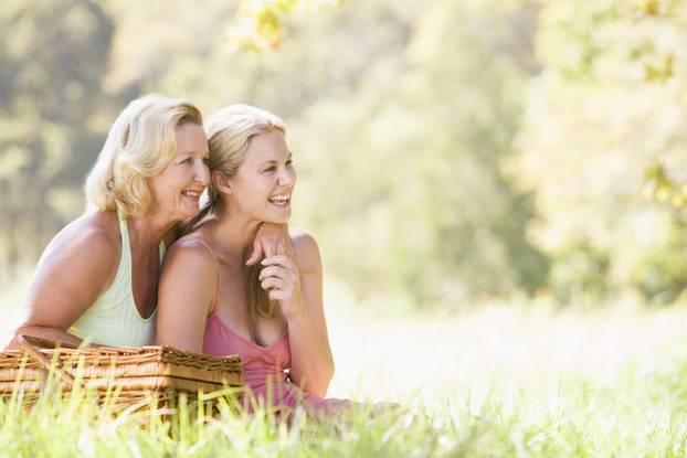 Mother with adult daughter on picnic