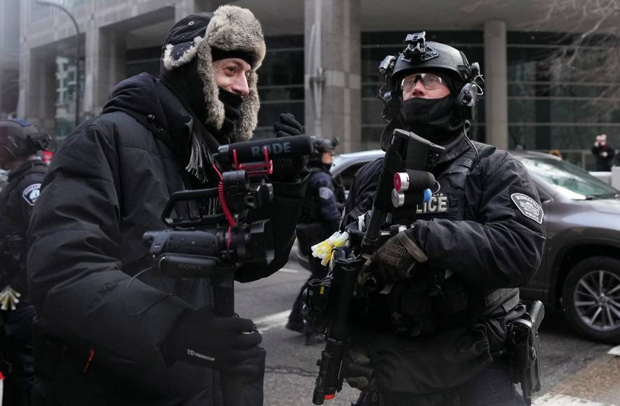 People attend the "March Against Minnesota Fraud" in Minneapolis