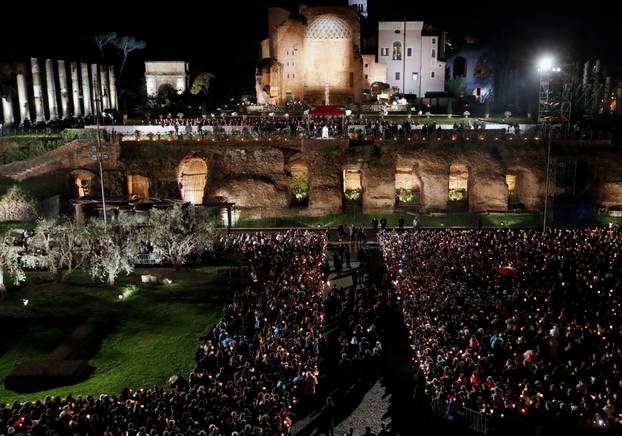 Pope Francis leads the Via Crucis (Way of the Cross) procession during Good Friday celebrations at the Colosseum in Rome