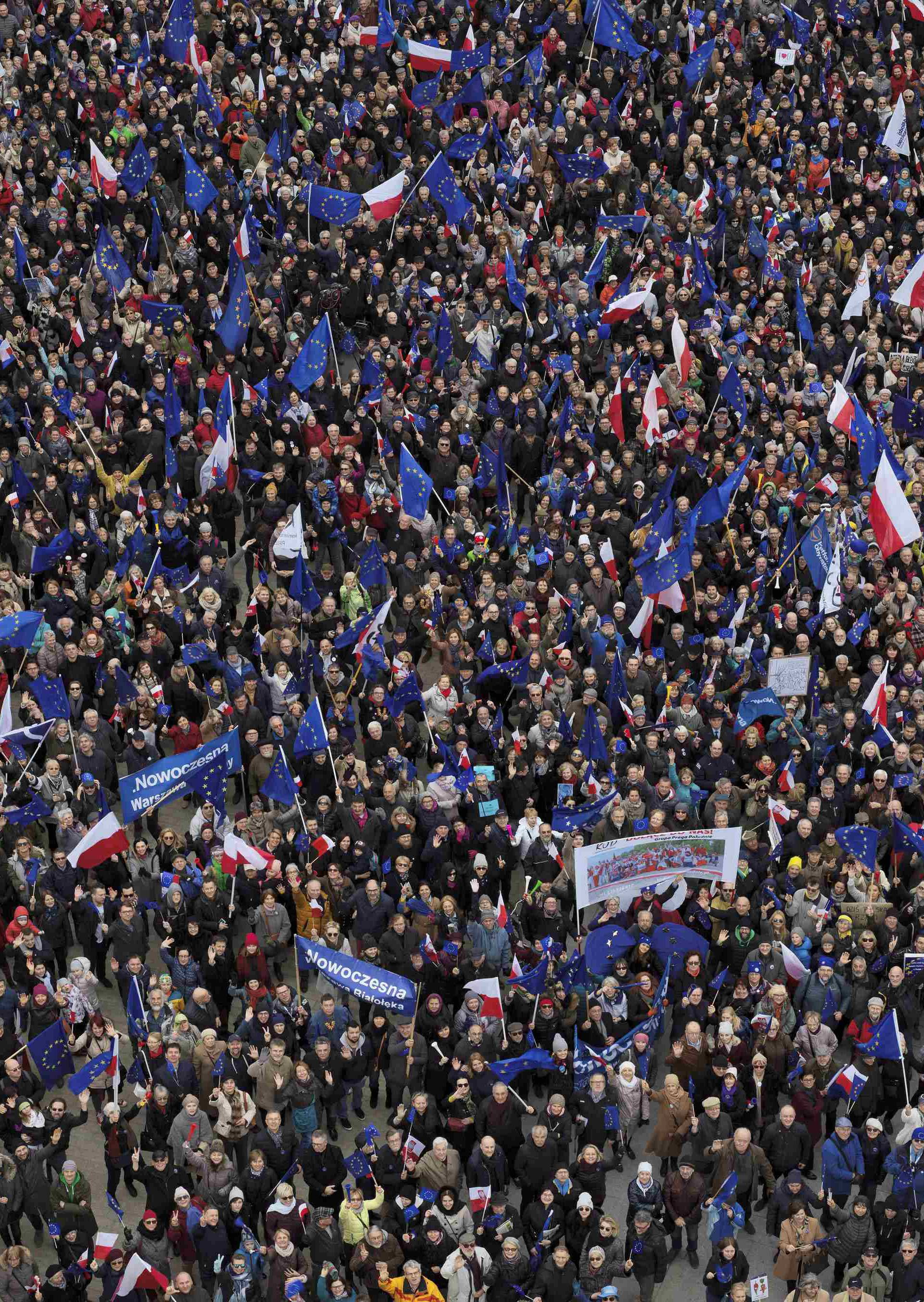 People gather for family picture during a march called 'I love Europe' to celebrate the 60th anniversary of the Treaty of Rome in Warsaw