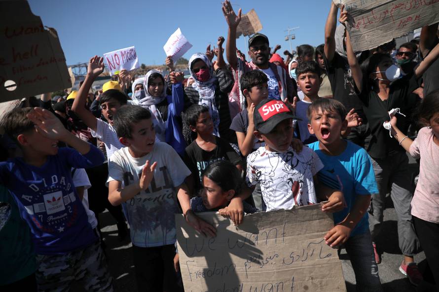 Refugees and migrants from the destroyed Moria camp protest on the island of Lesbos