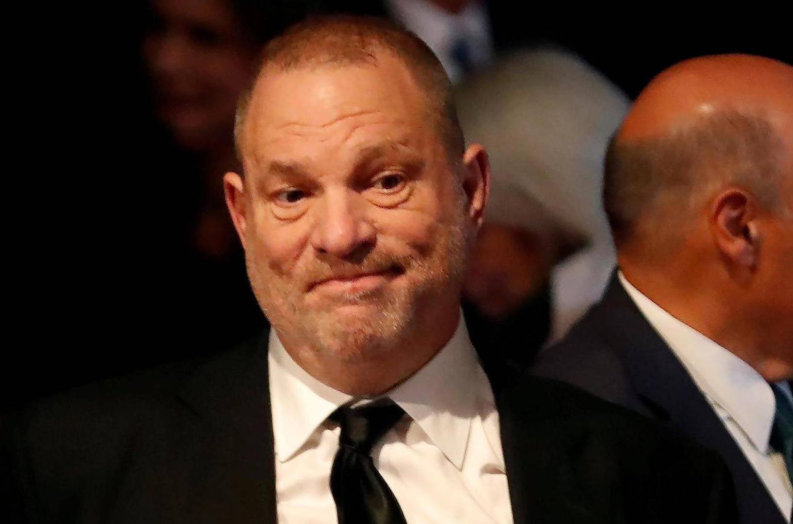 FILE PHOTO: Producer Weinstein stands in the audience ahead of the first presidential debate between U.S. presidential nominee Donald trump and U.S. presidential nominee Clinton in Hempstead