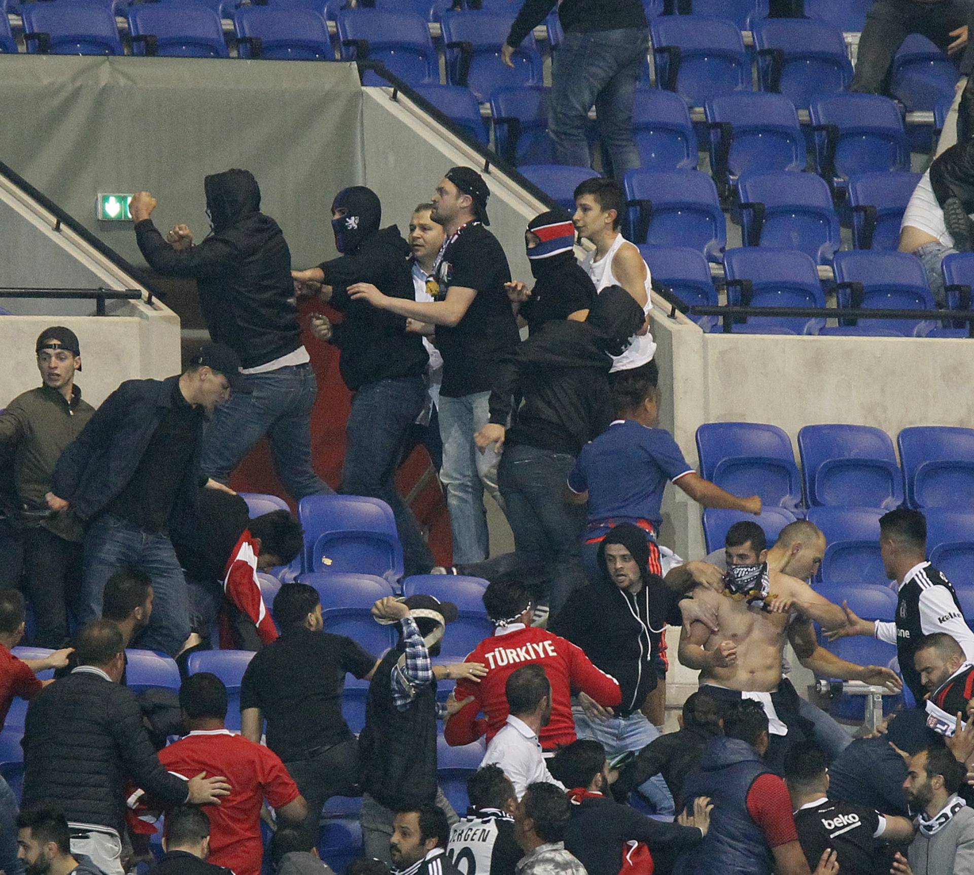 Besiktas and Lyon fans clash in the stands