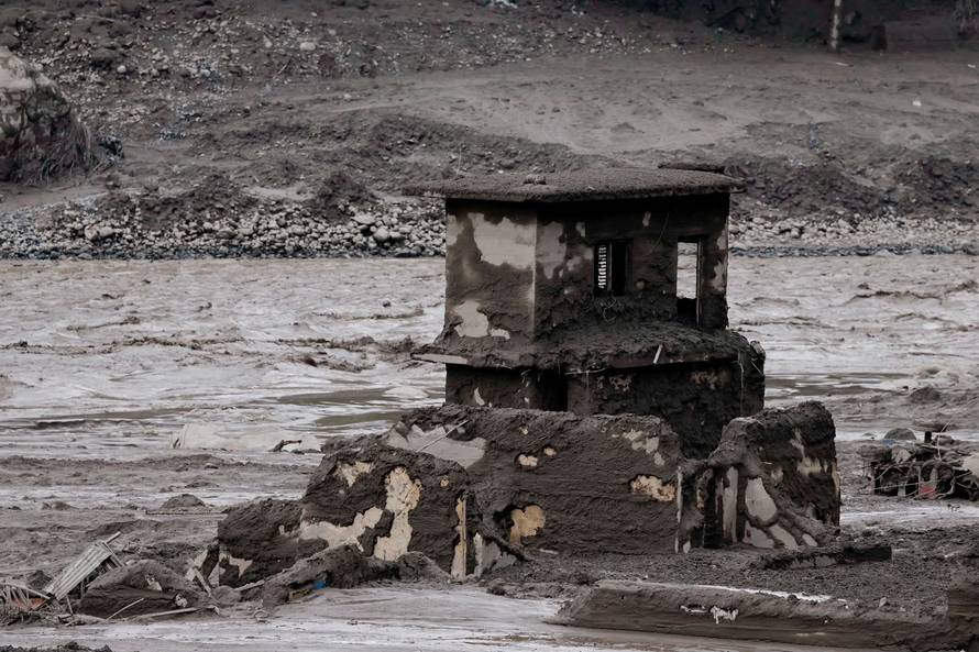 Mud covers a property following a flash flood at Trishuli, Nepal