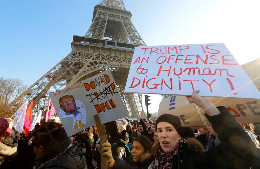 Protesters take part in the Women's March in Paris