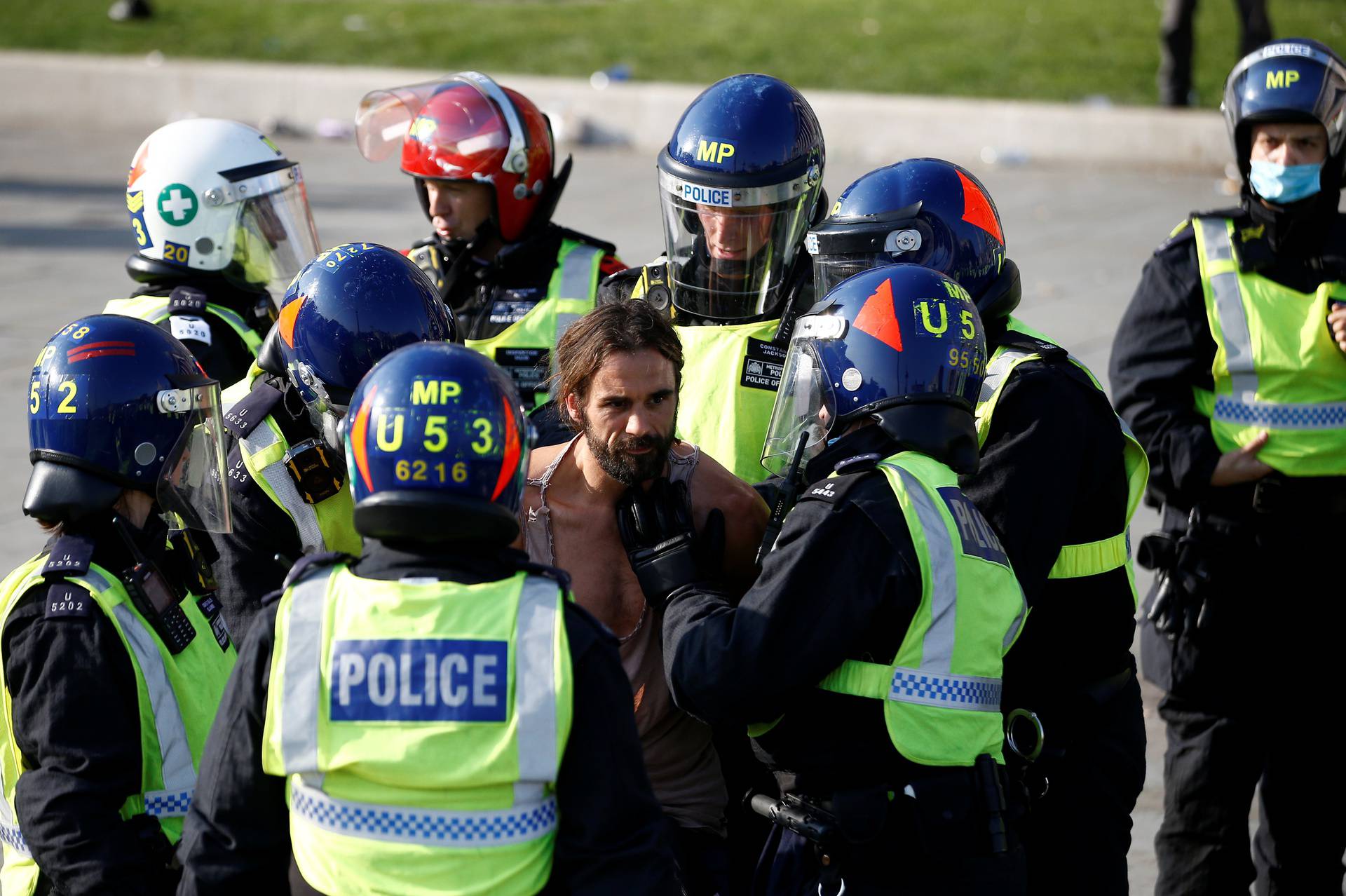 People gather in Trafalgar Square to protest against the lockdown imposed by the government, in London