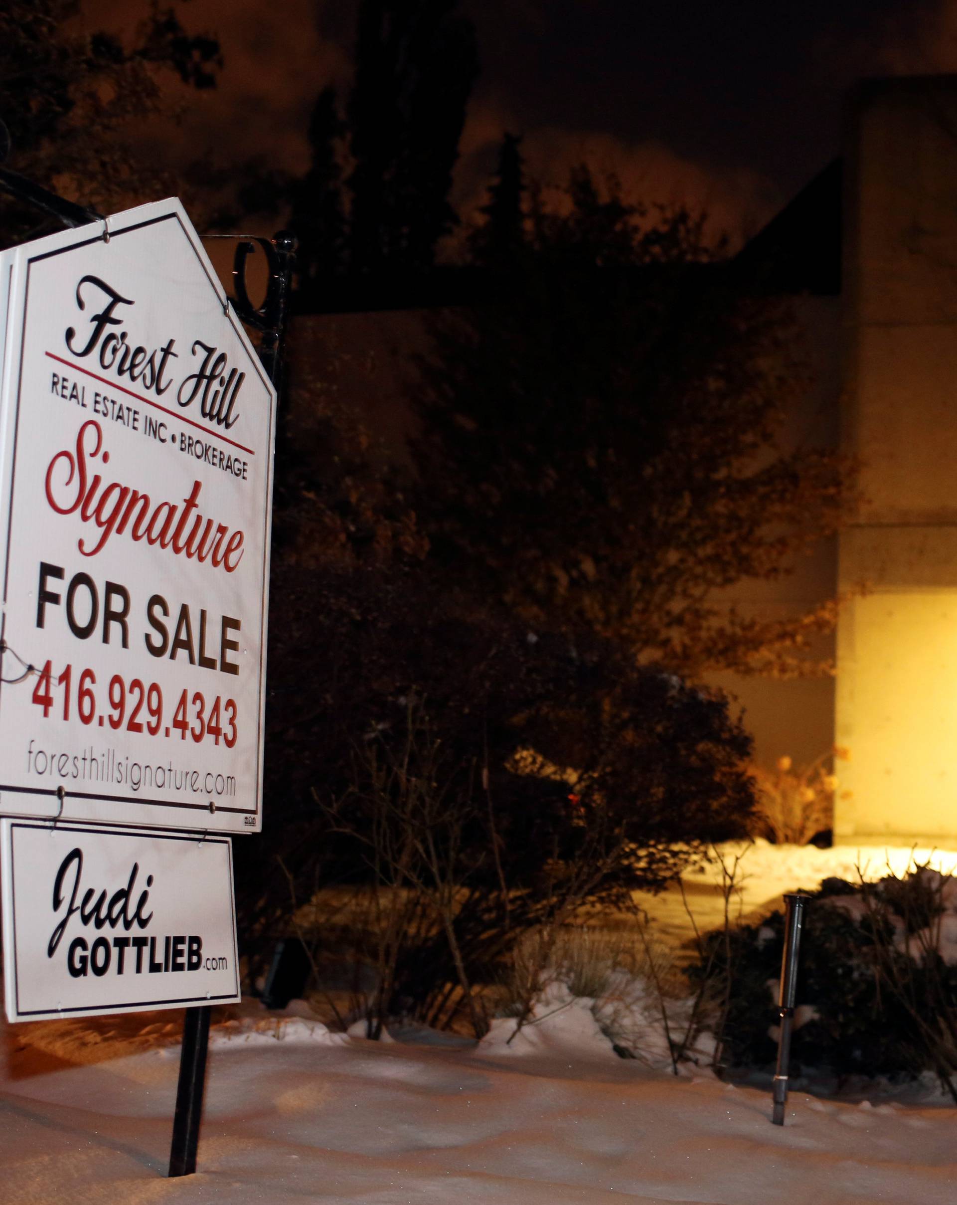 A For Sale sign stands outside the home of billionaire founder of Canadian pharmaceutical firm Apotex in Toronto
