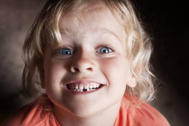 Child with missing tooth