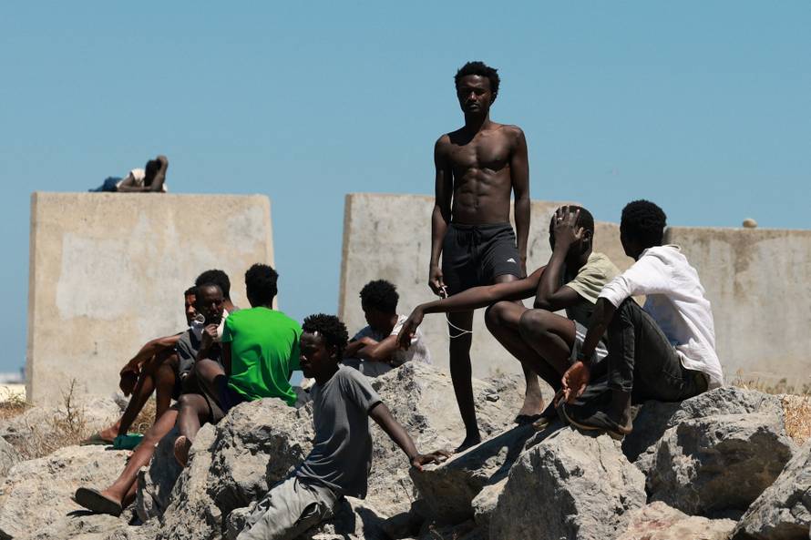 Mass crossings of migrants on foot and by sea from Morocco into Spanish territory, in Ceuta