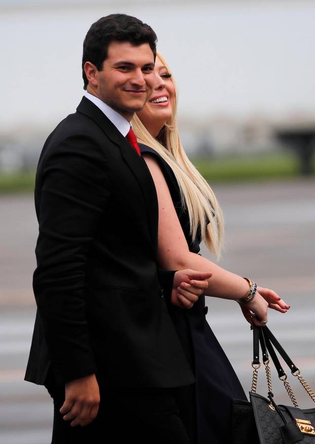 Tiffany Trump walks with her boyfriend Michael Boulos after arriving for a campaign rally in Orlando