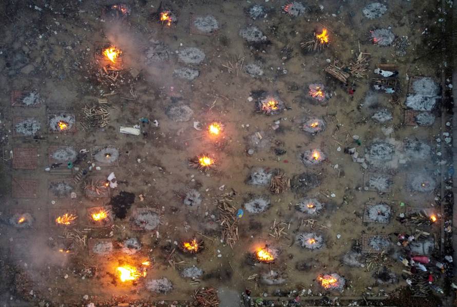 A mass cremation of victims who died due to the coronavirus disease (COVID-19), is seen at a crematorium ground in New Delhi