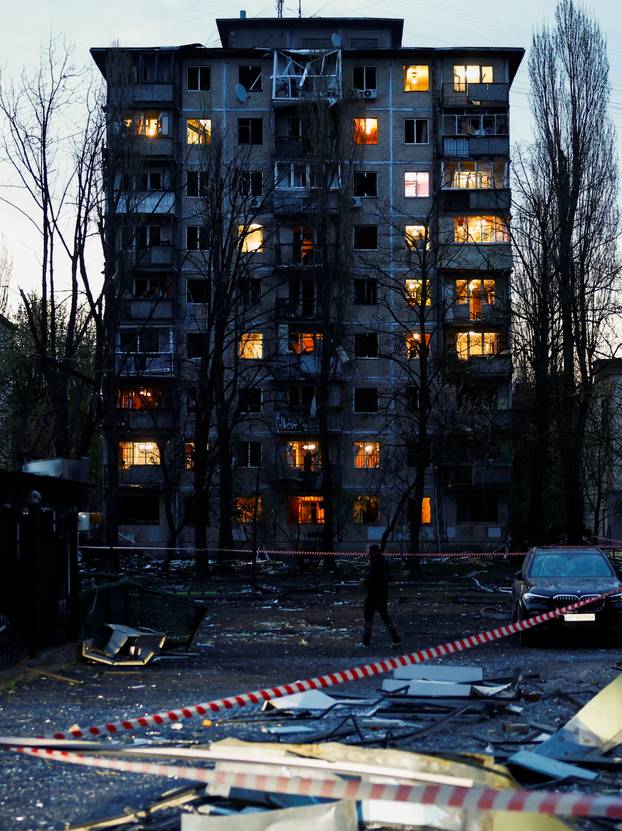 Rescuers work at the site of a Russian missile strike, amid Russia's attack on Ukraine, in Kyiv