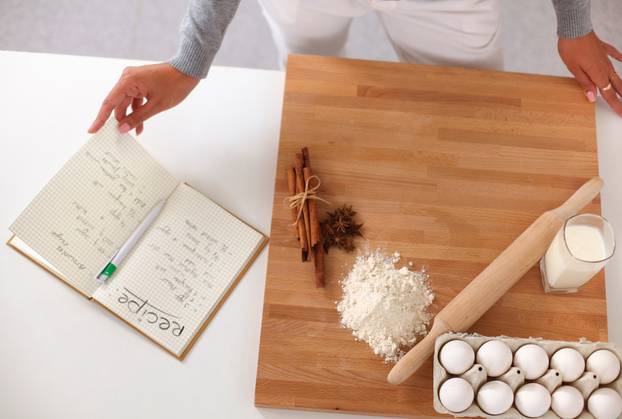 Woman is making cakes in the kitchen