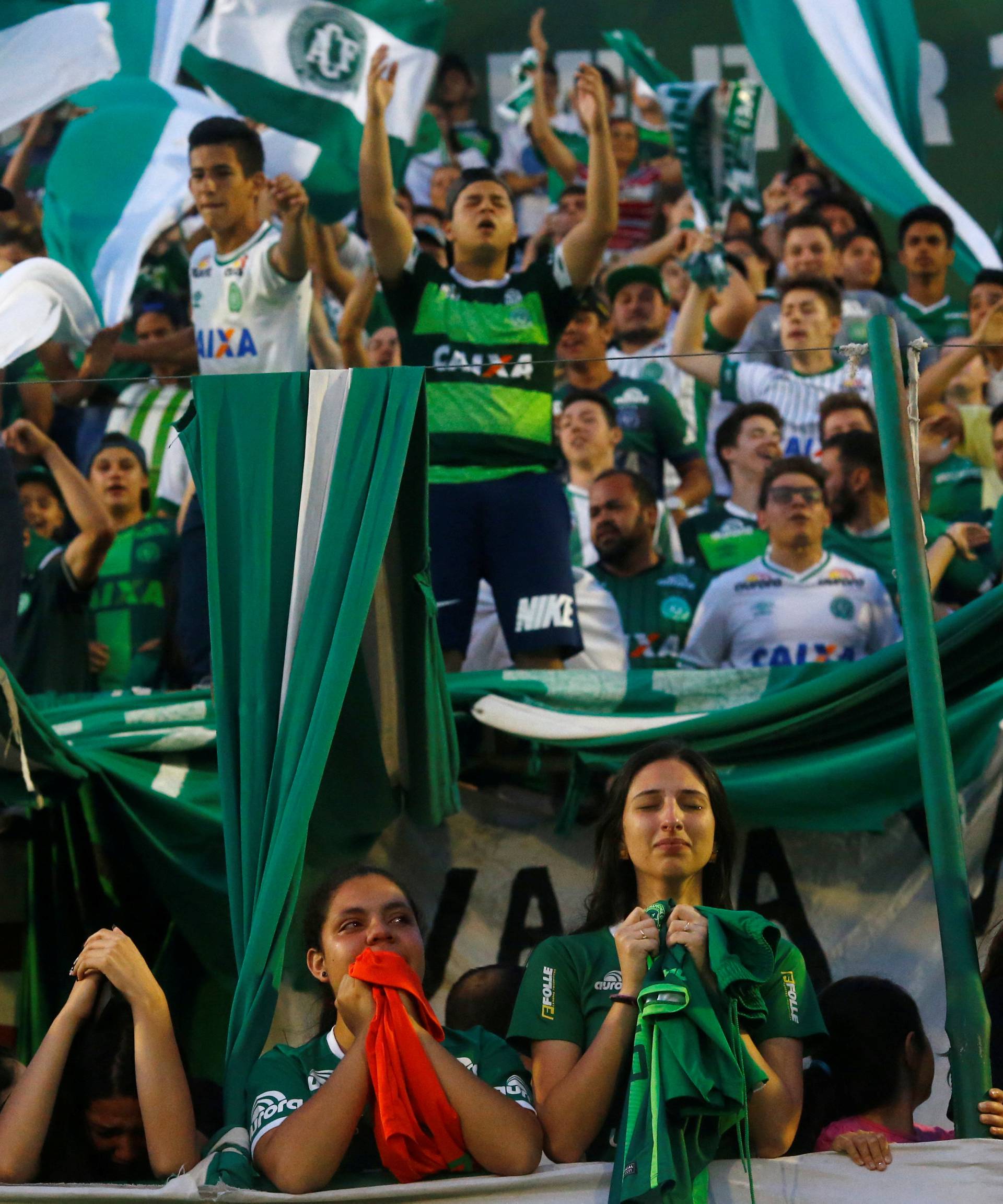 Fans of Chapecoense soccer team pay tribute to Chapecoense's players at the Arena Conda stadium in Chapeco