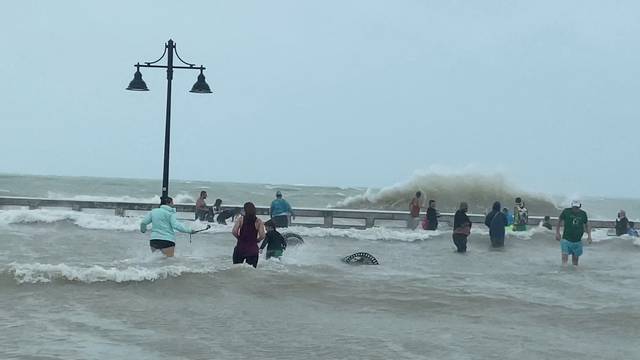 People gather at Key West pier as Hurricane Ian approaches