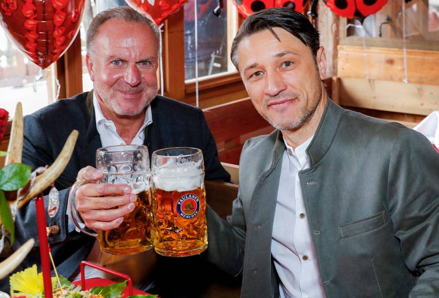 FC Bayern Munich's coach Niko Kovac and CEO Karl-Heinz Rummenigge pose during a visit at the Oktoberfest in Munich