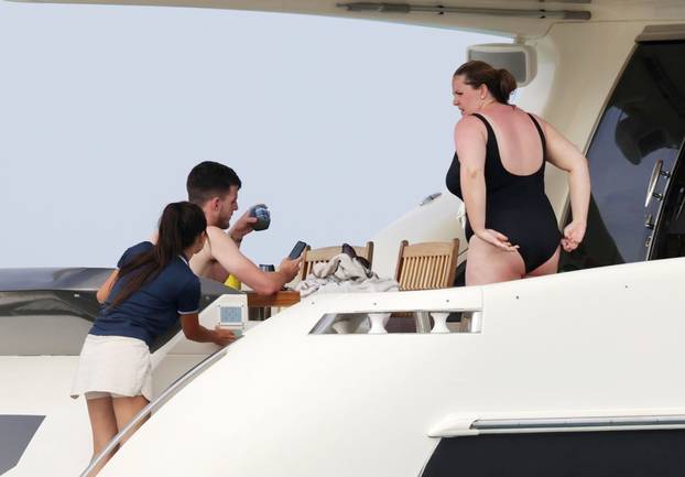 England footballer Declan Rice pictured on a luxury yacht with his girlfriend Lauren Fryer as they enjoy their holidays in Formentera!