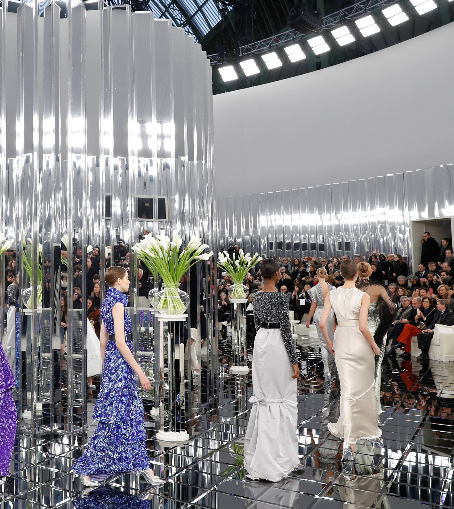 Models present creations by German designer Karl Lagerfeld as part of his Haute Couture Spring/Summer 2017 fashion show for Chanel in Paris